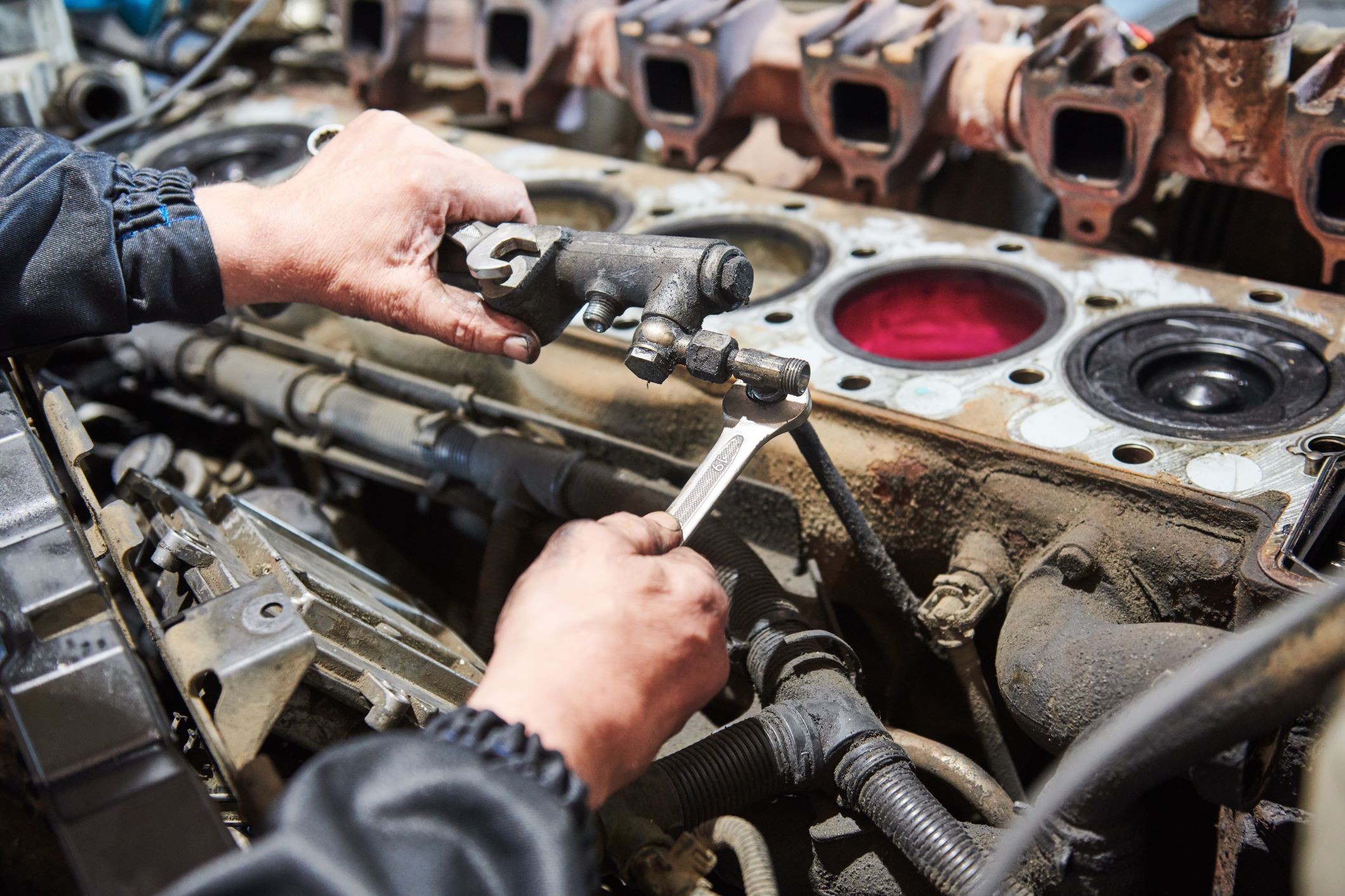 Mechanic working on a diesel truck engine