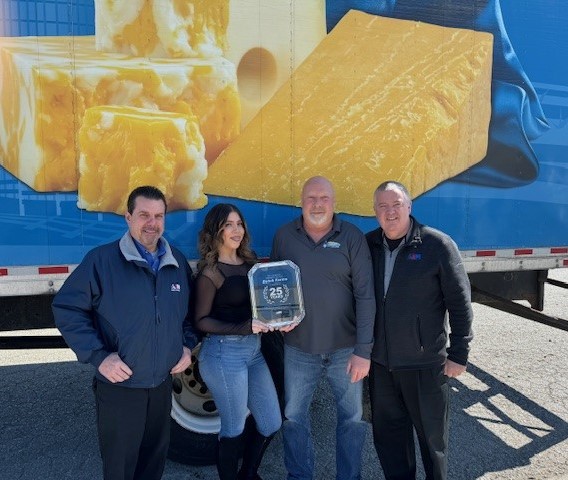 Picture of Kevin Cummings, Aim Regional Director of Maintenance; Jasmine Cortez, Dutch Farms Distribution Center Office Manager; Ron Maida, Dutch Farms Fleet Manager; and Tim Hanley, Aim Regional Vice President after presenting Dutch Farms with a commemorative plaque.